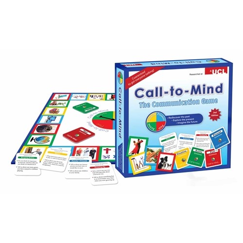 A white gameboard with yellow, red and green tiles and cards and spinner in the background. A blue game box with ”Call-to-Mind" in dark blue letters in the foreground.