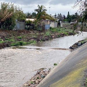 A flooded canal after a rainstorm