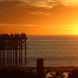 People on the Crystal Pier at Pacific Beach watching a sunset