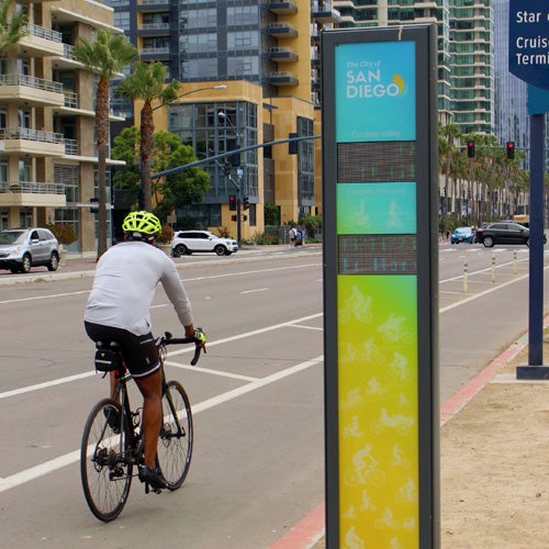 A bicyclist on a dedicated bike lane in downtown San Diego