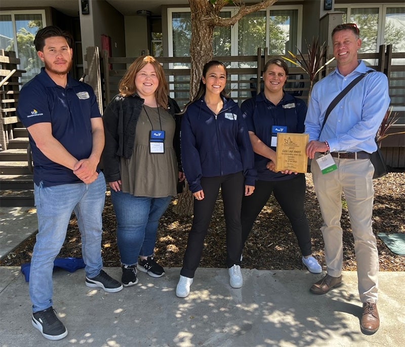 Urban Forestry staff proudly displaying their Gold Leaf Award