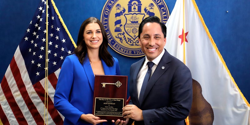 Alex Morgan accepting the key to the city from Mayor Todd Gloria