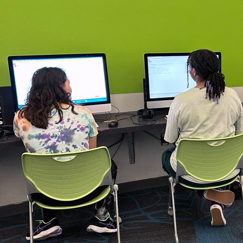 Students using computers to complete school work