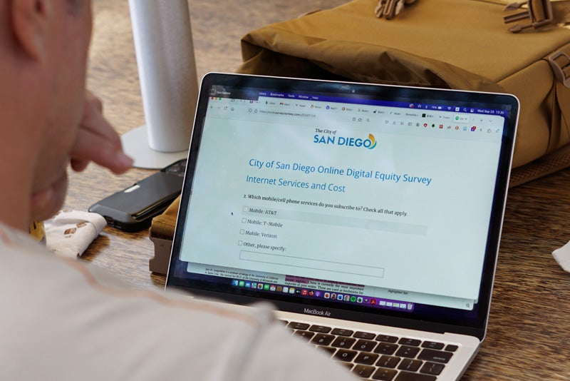 A person taking the Digital Equity Survey on a laptop