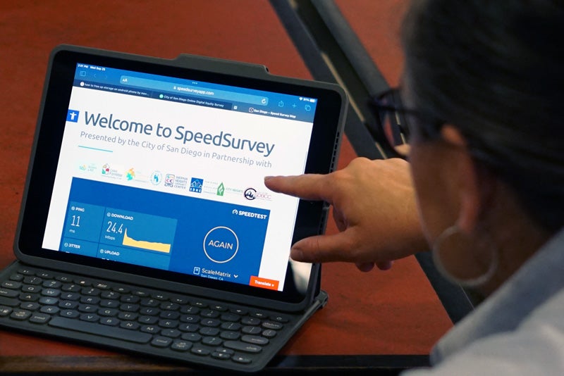 A person taking the SpeedSurvey on a tablet