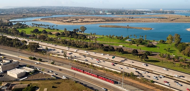 Overhead view of Mission Bay Park with the San Diego trolley in the foreground