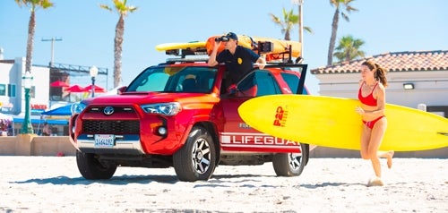 Lifeguard and lifeguard vehicle at the beach