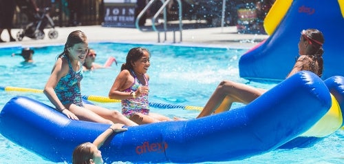 Photo of children playing in pool