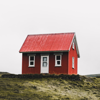 Image of a house with red paint