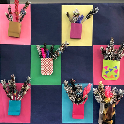 Collage of paper flowers and paper bags using old and recycled magazines