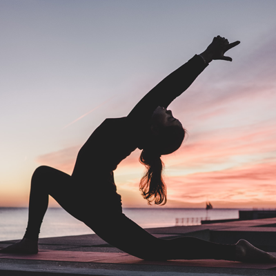 Silhouette of person performing a yoga pose