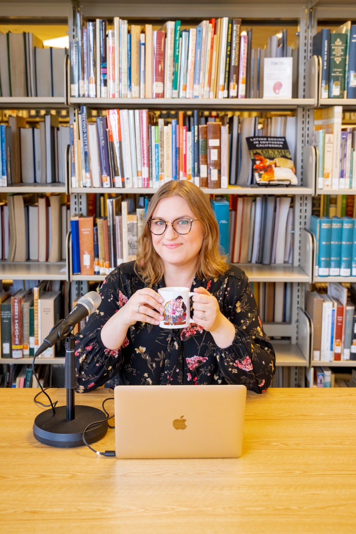 Librarian Jessica Buck in front of a book shelf