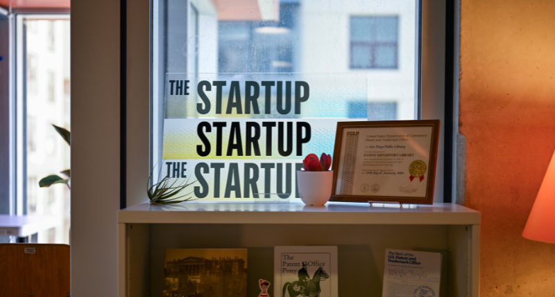 The StartUp sign on top of a bookshelf