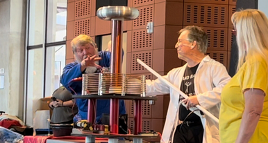 Three people conducting a science experiement