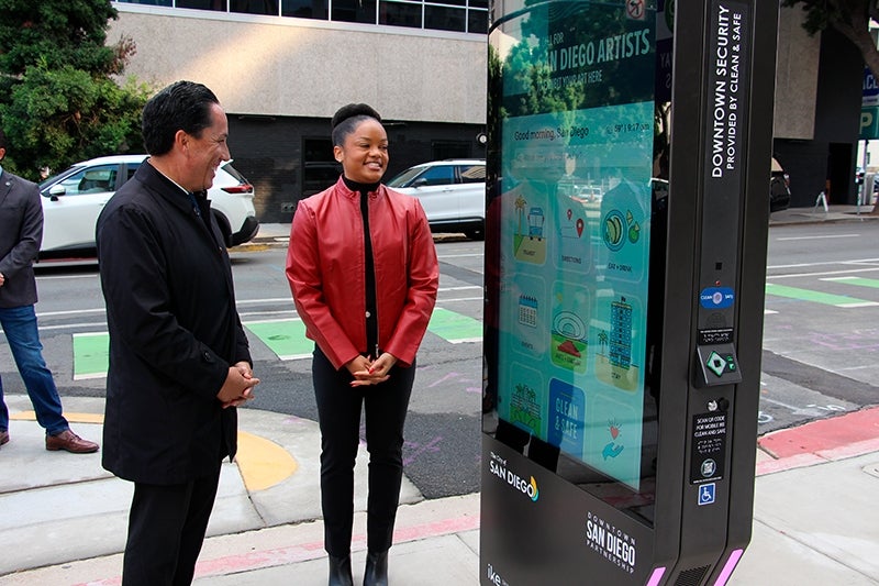 Mayor Gloria viewing the Downtown Navigation Kiosk