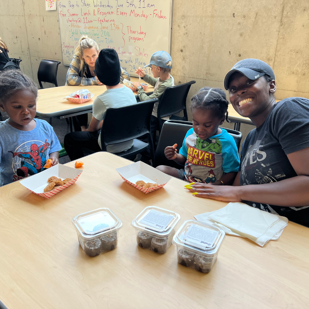 A happy family is enjoying the summer lunch program!