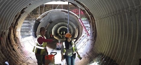 Workers remove debris and inspect damaged areas inside the storm drain as part of the Villa La Jolla Drive Drainage System Emergency project. Work on the project continues seven days per week from 7 a.m. to 7 p.m.