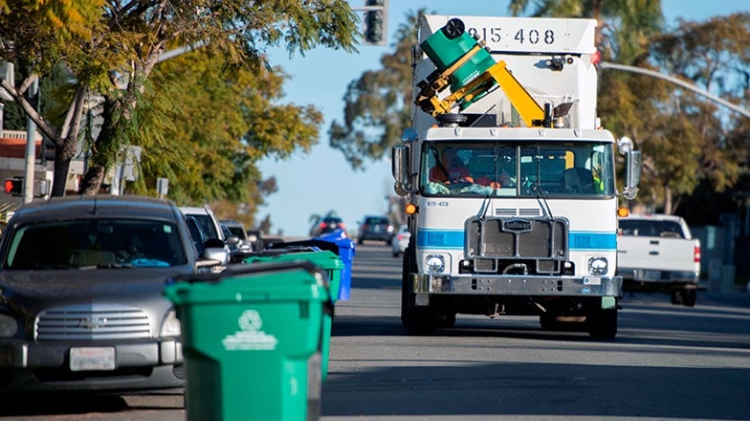 City of San Diego Waste Collection Truck on city street.