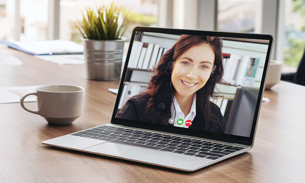 A laptop with a video call in progress
